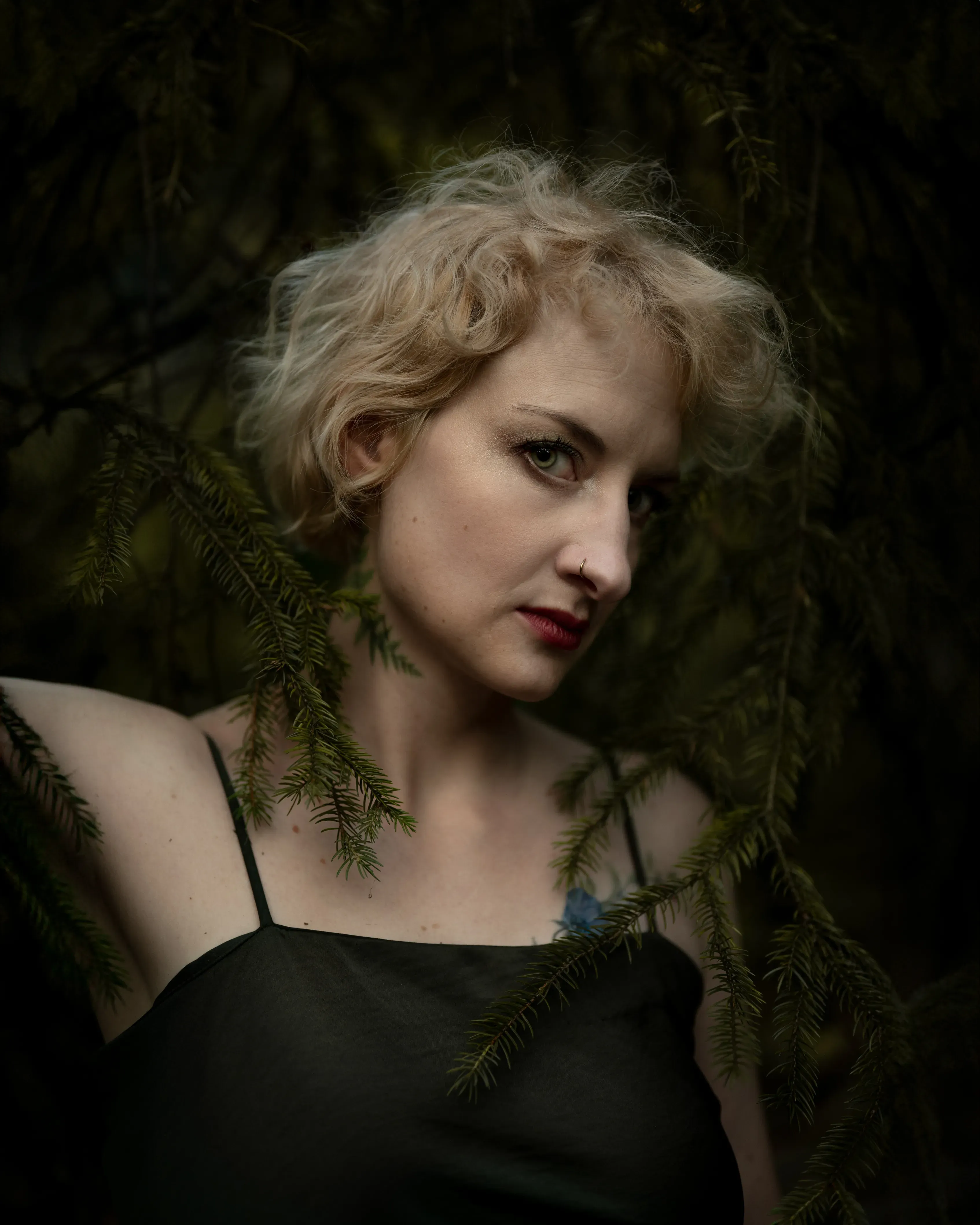 Female portrait in forest light — Lios Storia