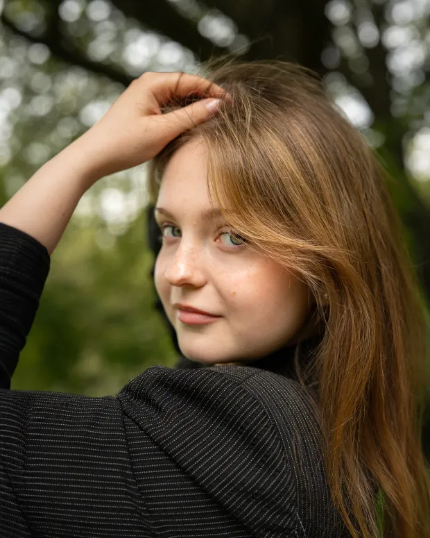 Over-the-shoulder portrait, natural smile