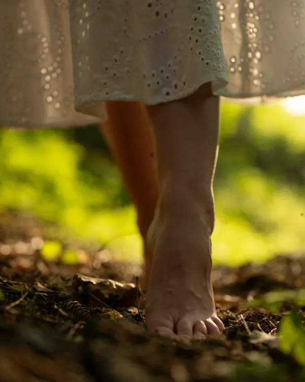 Outdoor female session — bare feet on the forest floor