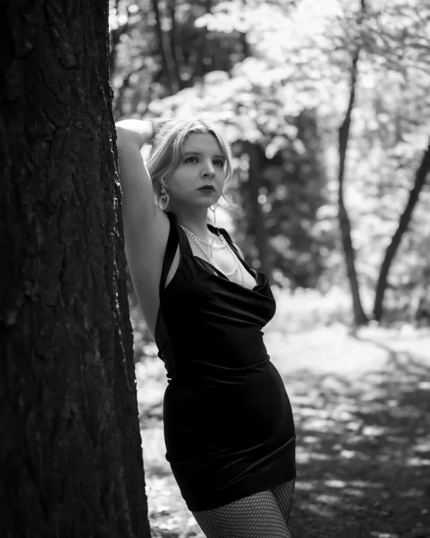 Black-and-white female portrait in the forest