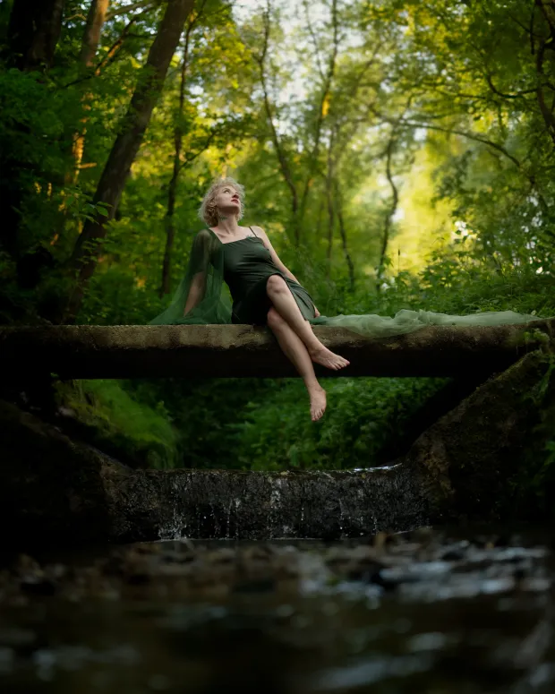Outdoor female session by a forest stream